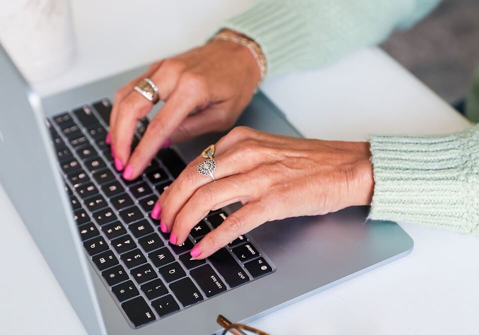 Woman typing on laptop