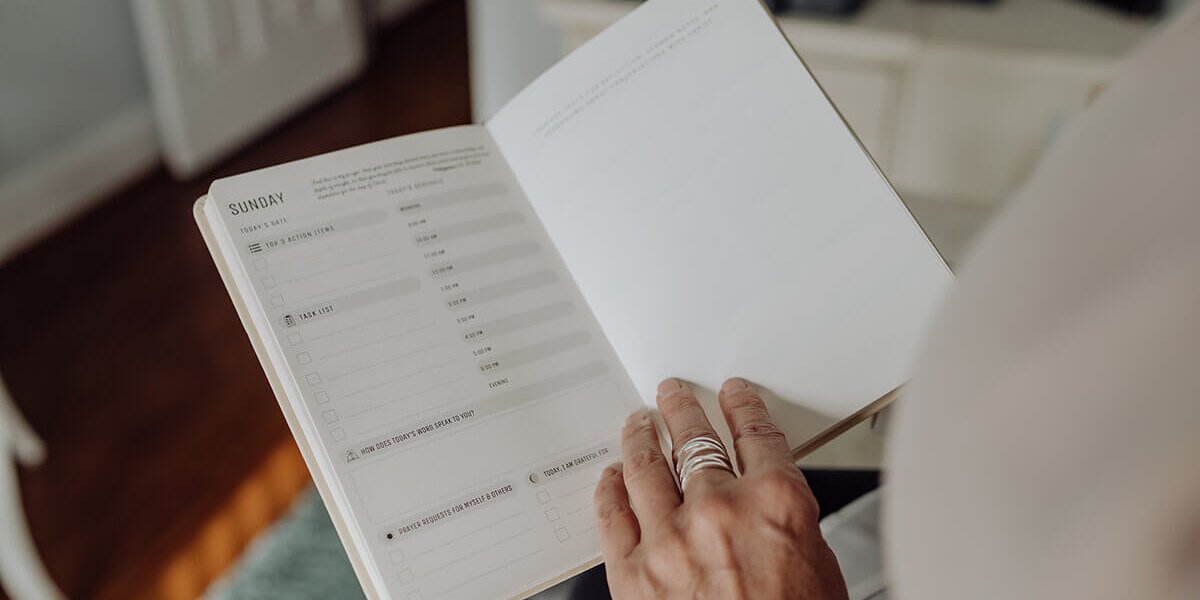 Woman holding open calendar